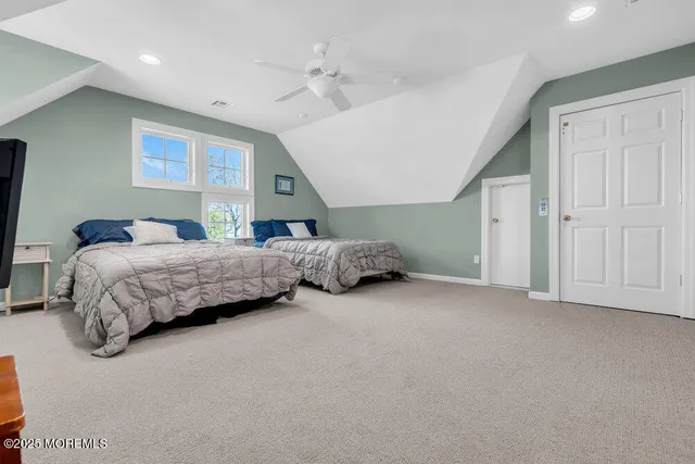 a bedroom with a bed and a cabinets