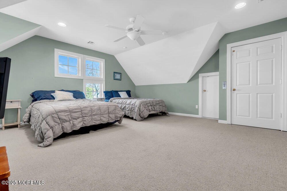 412 Chicago Boulevard Sea Girt, NJ 08750 - Photo 35 of 47 a bedroom with a bed and a cabinets