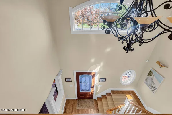 a view of staircase with wooden floor