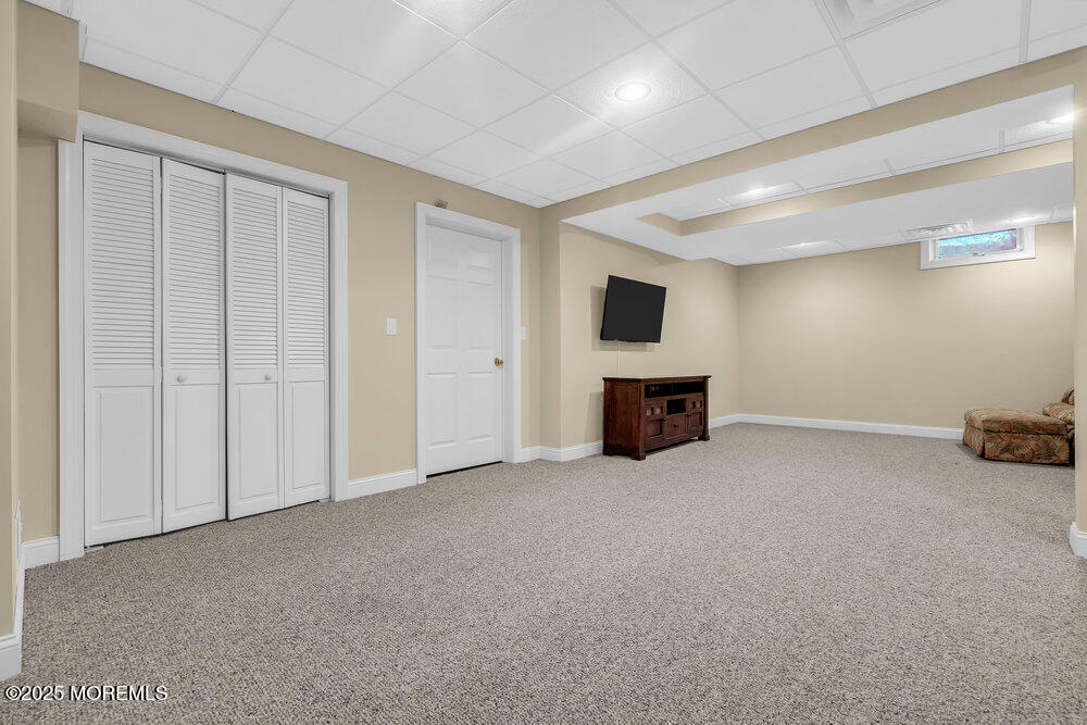 412 Chicago Boulevard Sea Girt, NJ 08750 - Photo 43 of 47 an empty room with furniture and fireplace