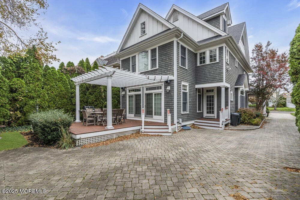 412 Chicago Boulevard Sea Girt, NJ 08750 - Photo 45 of 47 a front view of a house with a yard