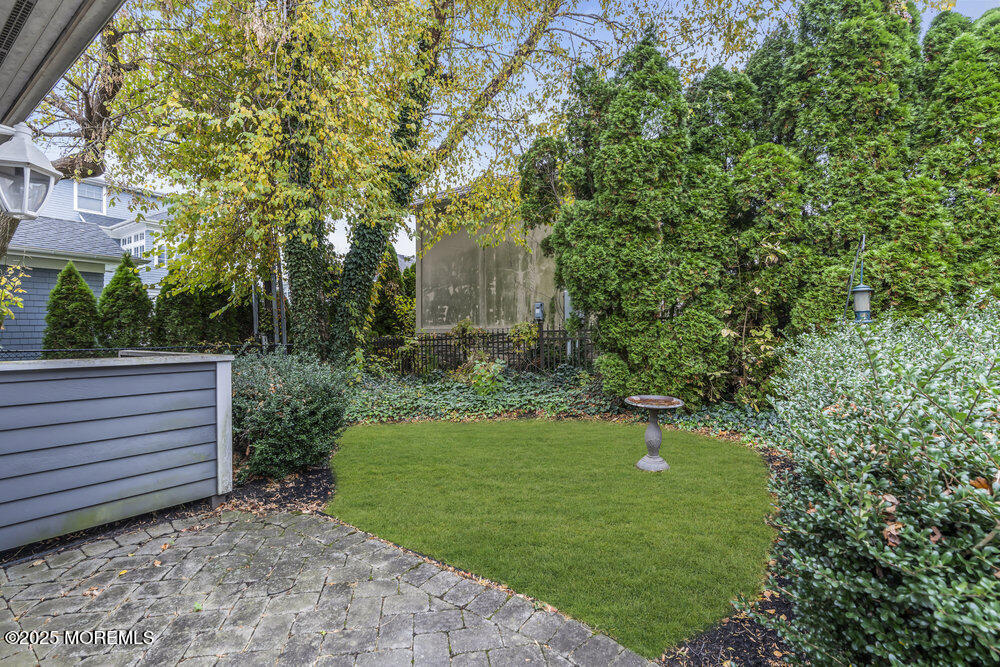 412 Chicago Boulevard Sea Girt, NJ 08750 - Photo 47 of 47 a view of a backyard with plants and a garden