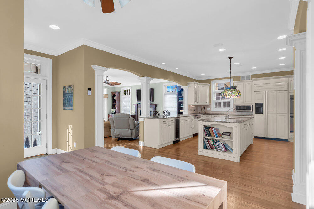 412 Chicago Boulevard Sea Girt, NJ 08750 - Photo 7 of 47 a living room with kitchen island furniture and a wooden floor