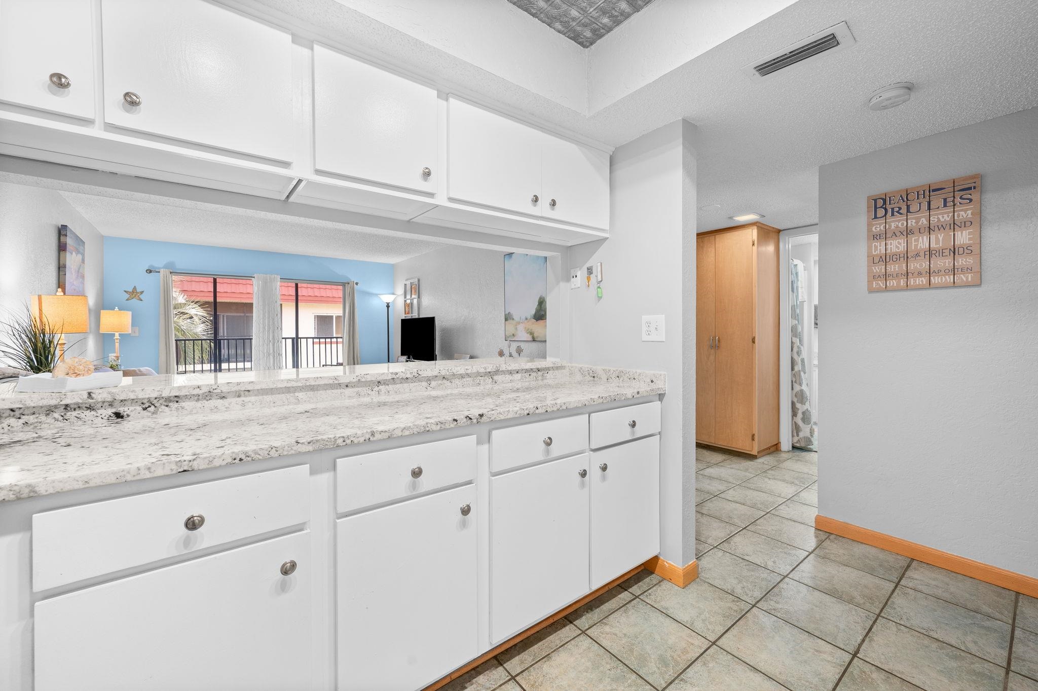 7175 A1A South, Unit F237 St. Augustine, FL 32080 - Photo 14 of 63 a bathroom with a granite countertop double vanity sink and mirror