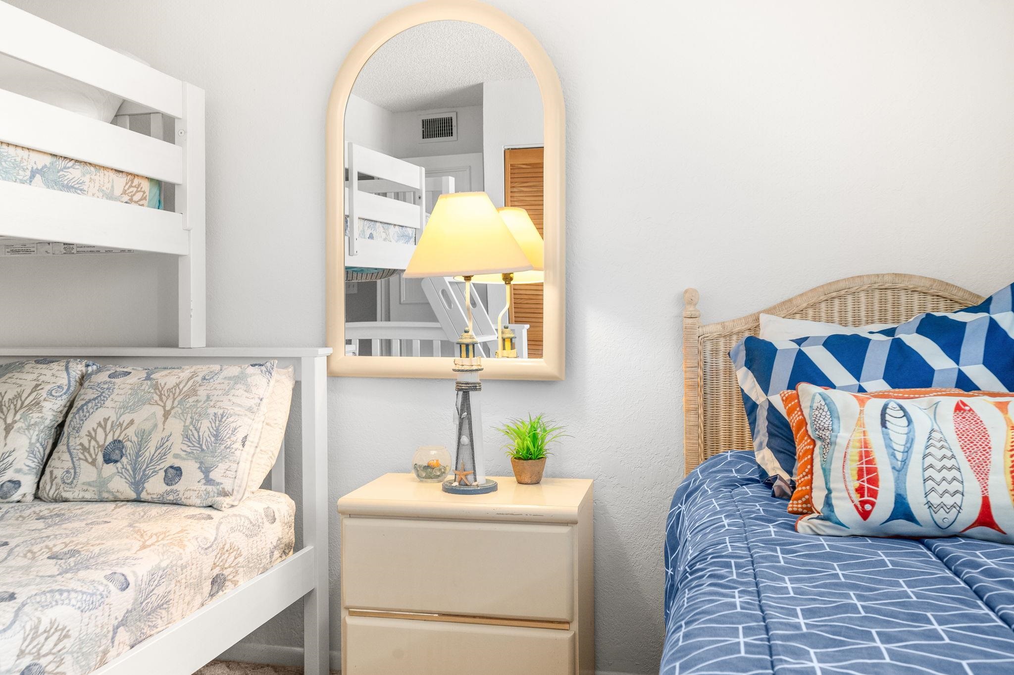 7175 A1A South, Unit F237 St. Augustine, FL 32080 - Photo 28 of 63 a bedroom with a bed and a painting on the wall