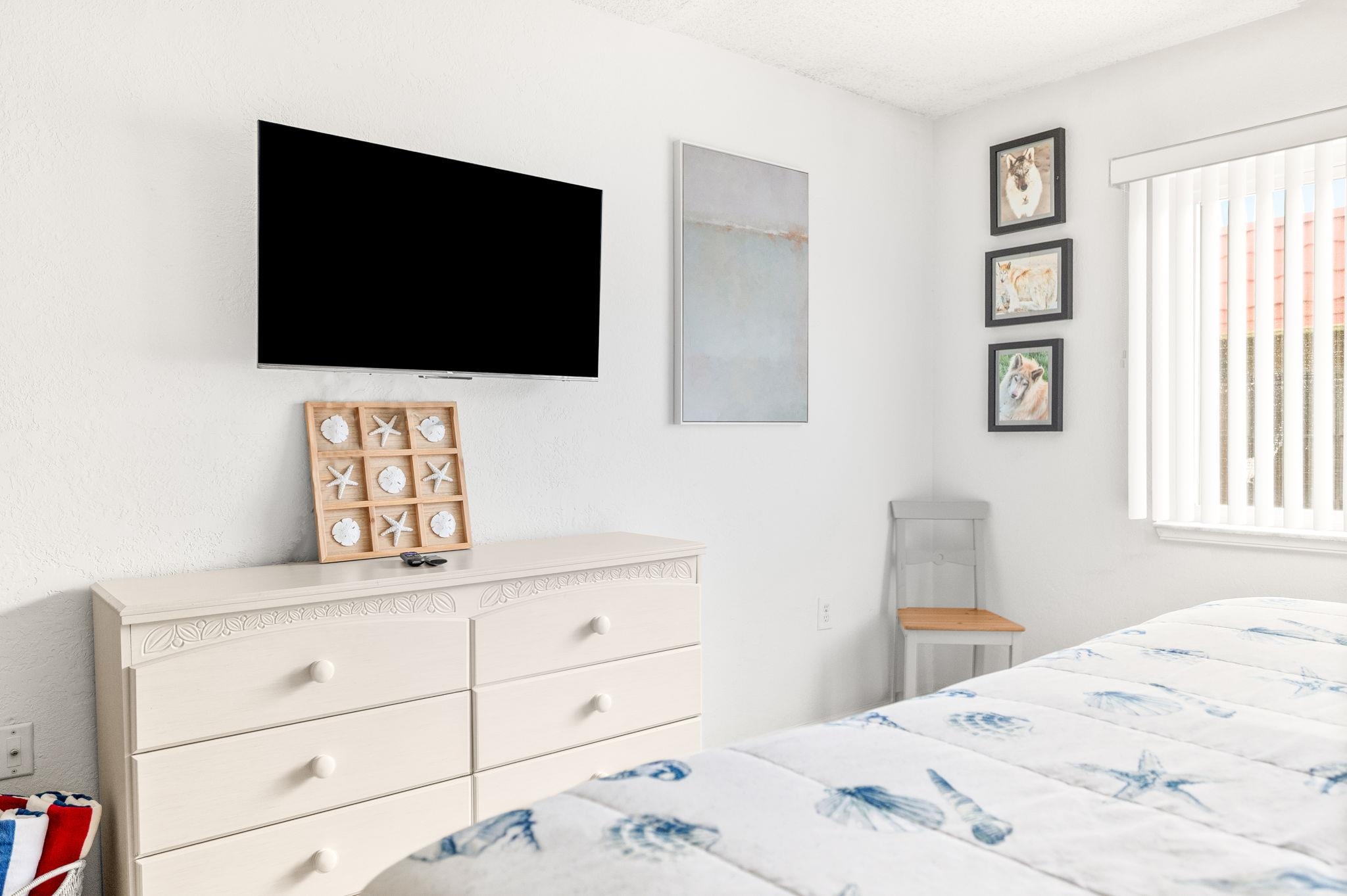 7175 A1A South, Unit F237 St. Augustine, FL 32080 - Photo 31 of 63 a bedroom with a bed and a flat screen tv