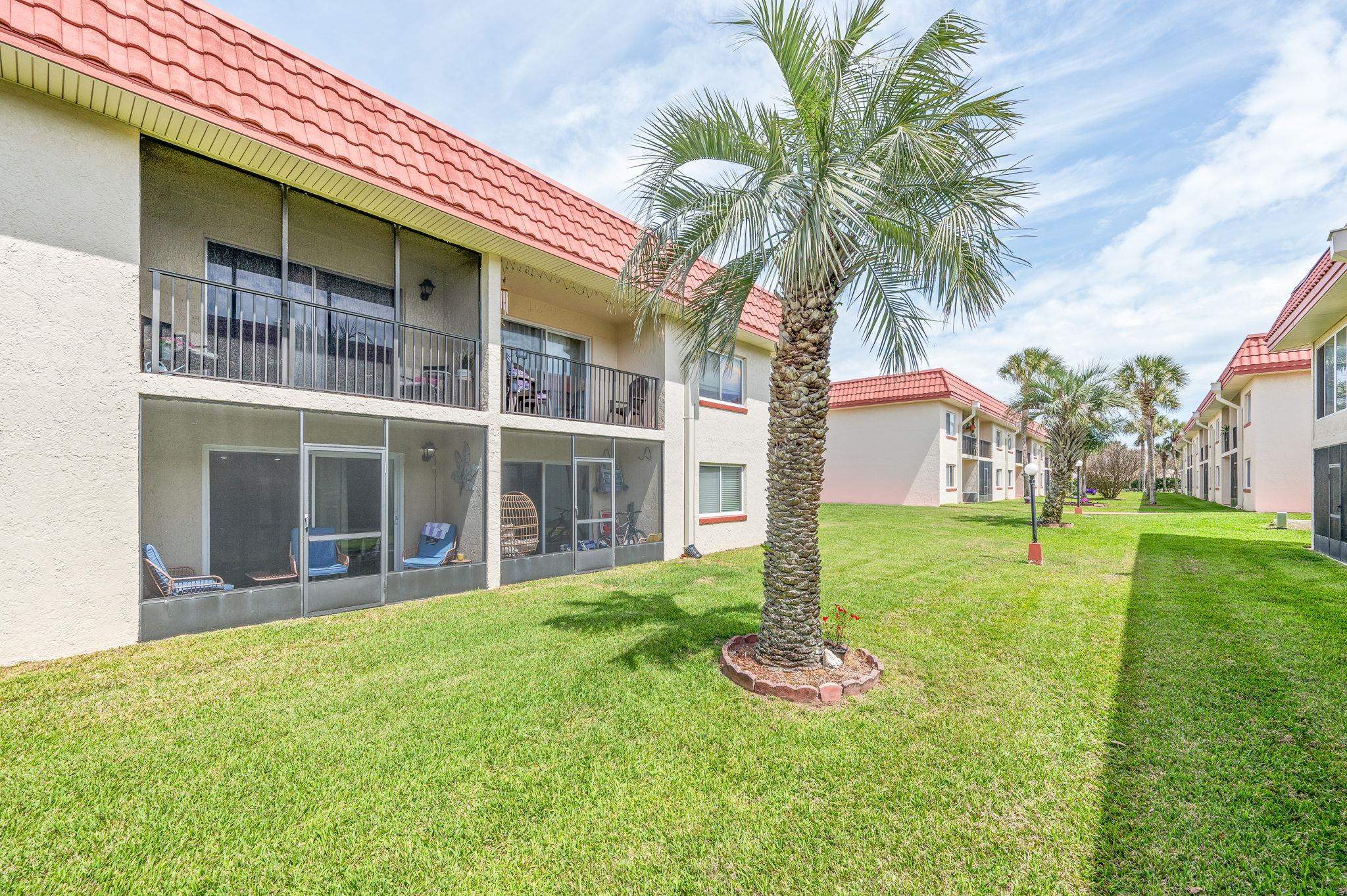 7175 A1A South, Unit F237 St. Augustine, FL 32080 - Photo 34 of 63 a front view of a house with a yard