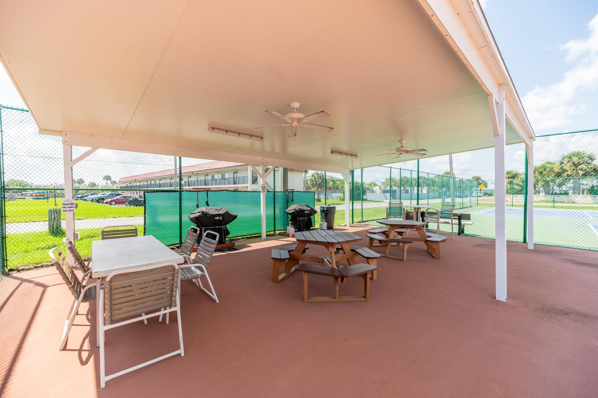 7175 A1A South, Unit F237 St. Augustine, FL 32080 - Photo 42 of 63 a building outdoor space with patio furniture and garden