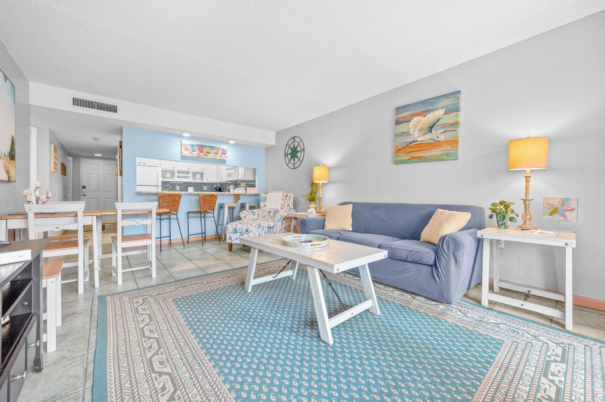 7175 A1A South, Unit F237 St. Augustine, FL 32080 - Photo 7 of 63 a living room with furniture a rug and a table