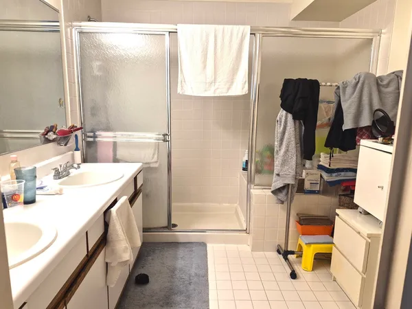 a bathroom with a sink a toilet and shower curtain