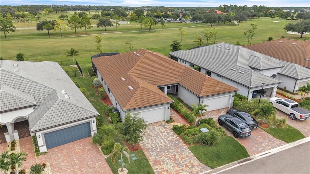 an aerial view of a house with outdoor space and lake view