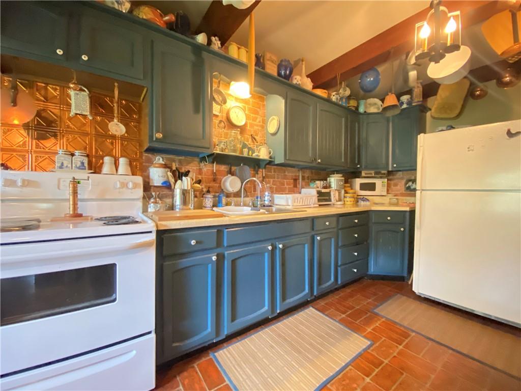 1120 Fredonia Road Hadley, PA 16130 - Photo 13 of 23 a kitchen with a sink cabinets and appliances