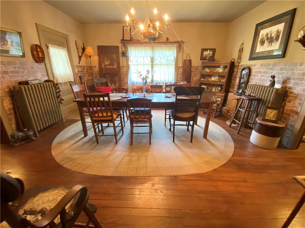 1120 Fredonia Road Hadley, PA 16130 - Photo 16 of 23 a dining room with furniture and wooden floor