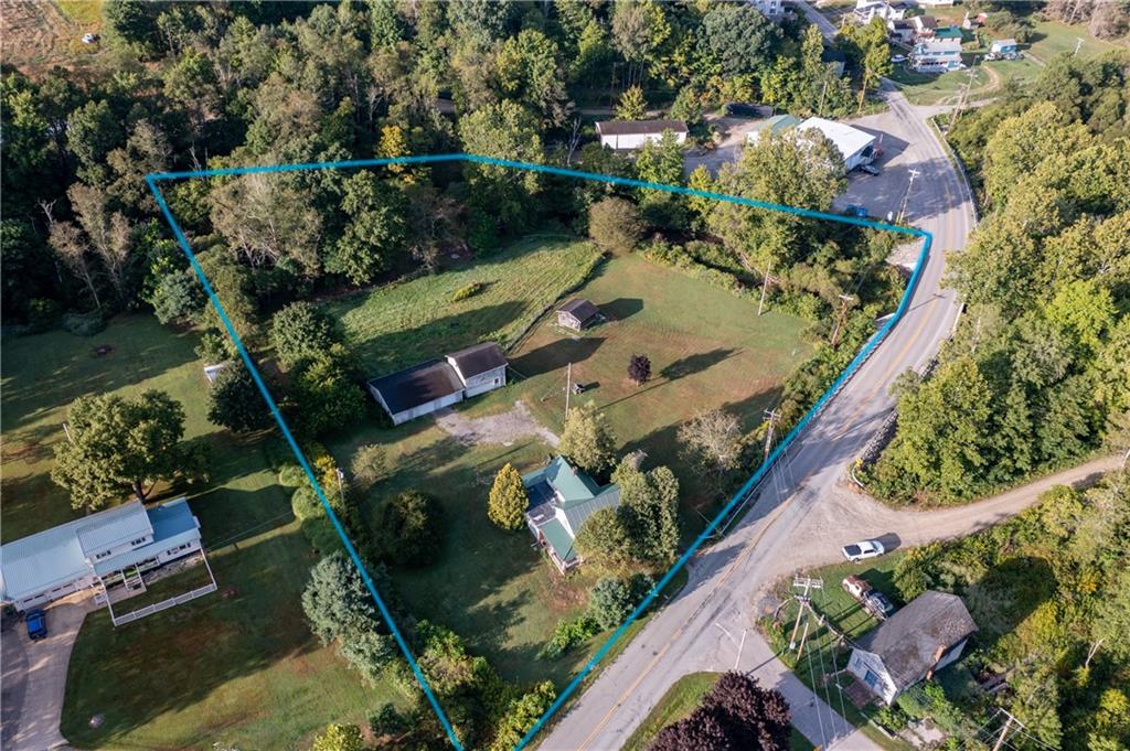 1120 Fredonia Road Hadley, PA 16130 - Photo 3 of 23 an aerial view of a house a garden and mountain view in back
