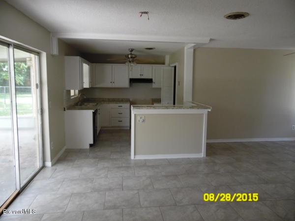 2013 Cooper Drive Cocoa, FL 32922 - Photo 8 of 23 Dining Into Kitchen
