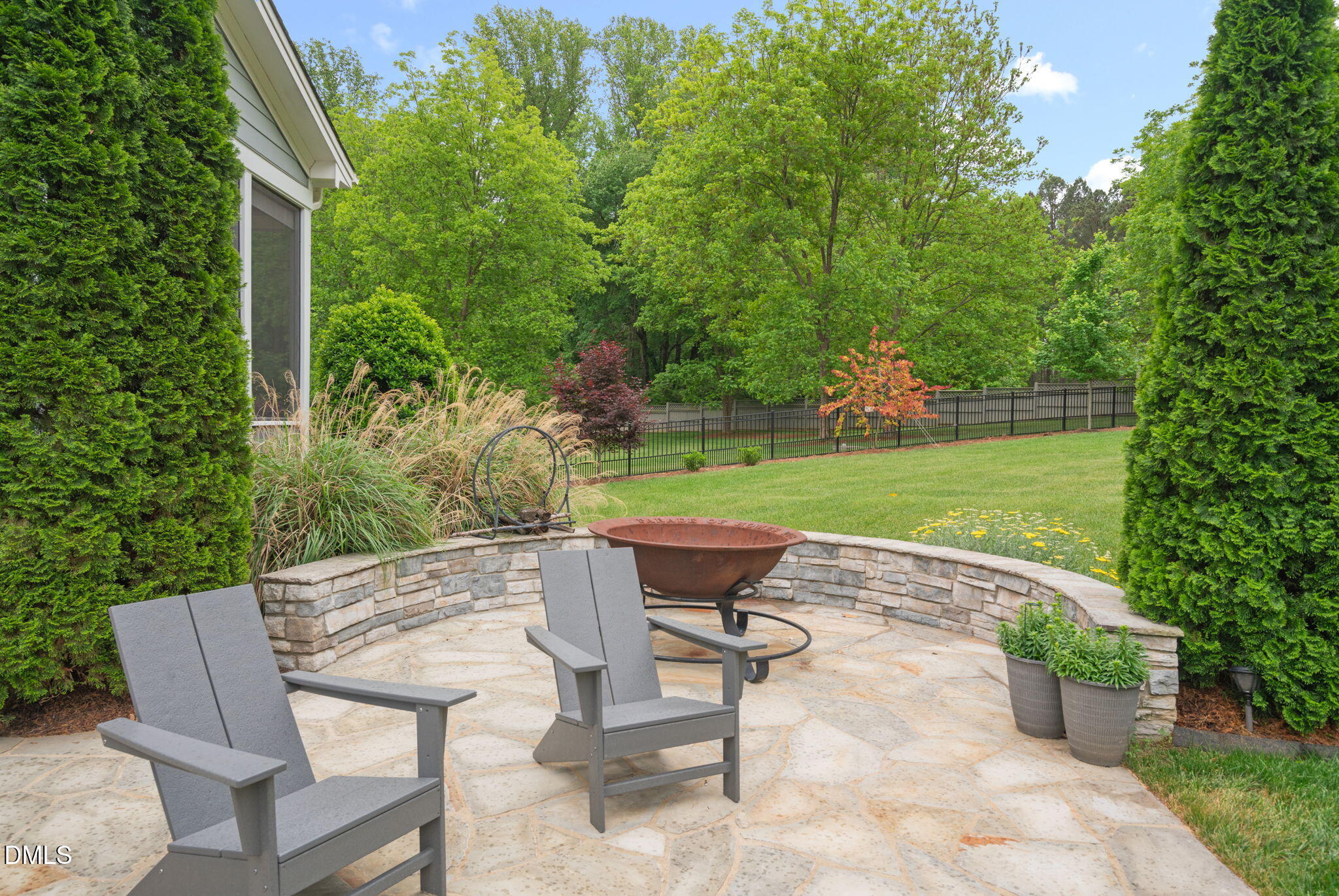 6901 Ray Family Farm Court Raleigh, NC 27613 - Photo 42 of 52 an outdoor sitting area with a table and chair