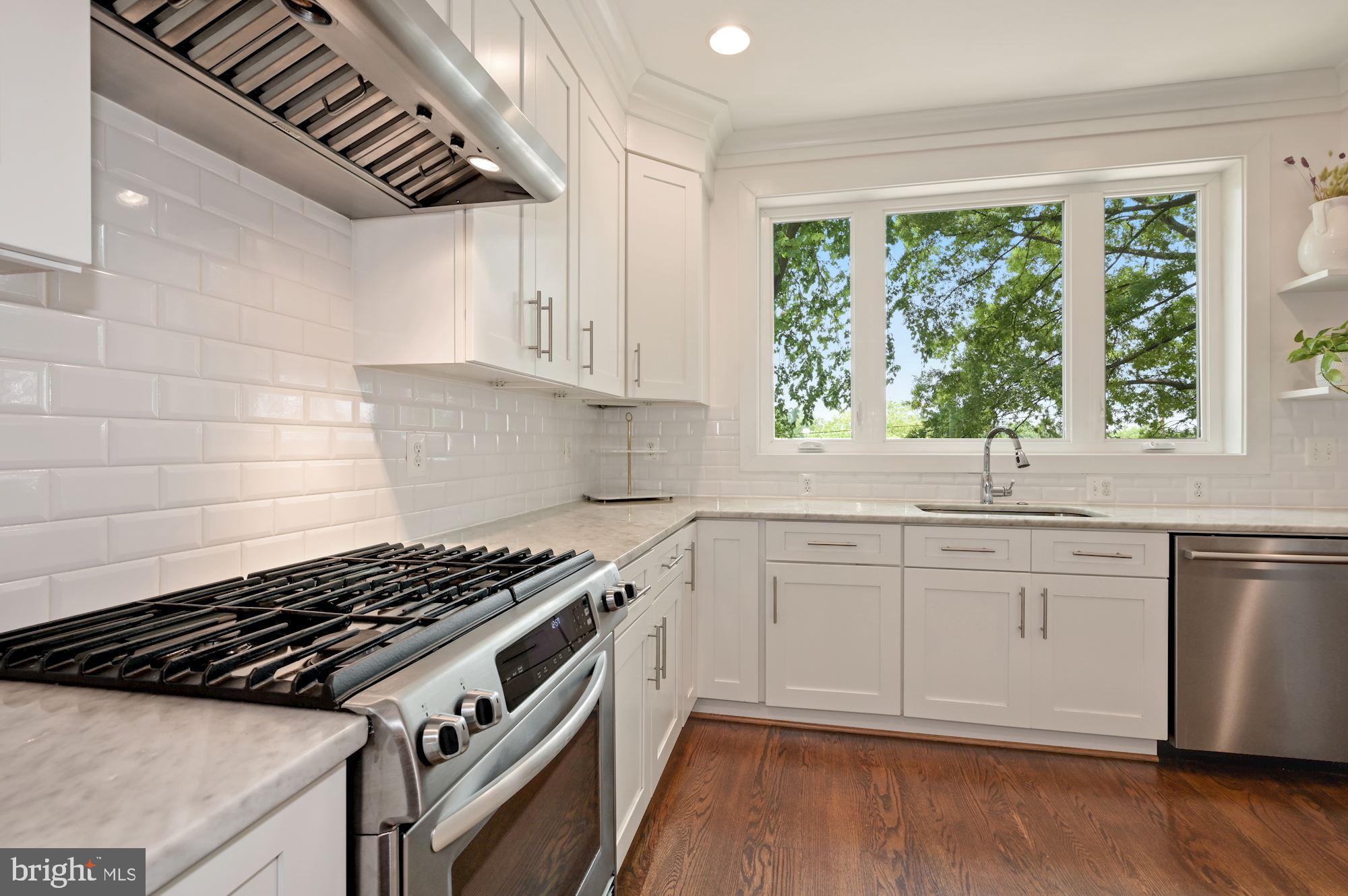 4110 3rd Street Northwest Washington, DC 20011 - Photo 13 of 35 a kitchen with granite countertop a stove and cabinets
