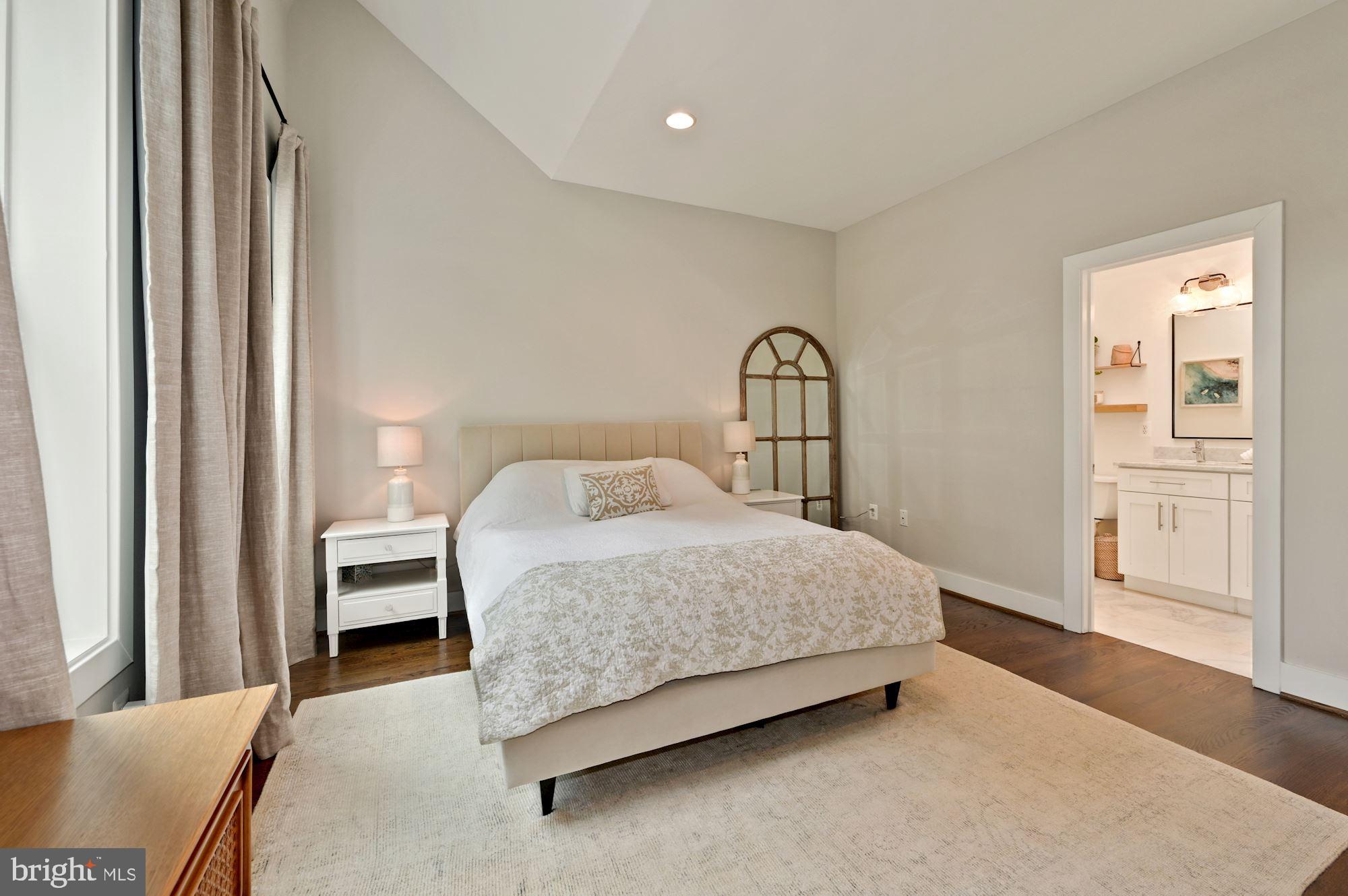 4110 3rd Street Northwest Washington, DC 20011 - Photo 19 of 35 a bedroom with a bed and wooden floor