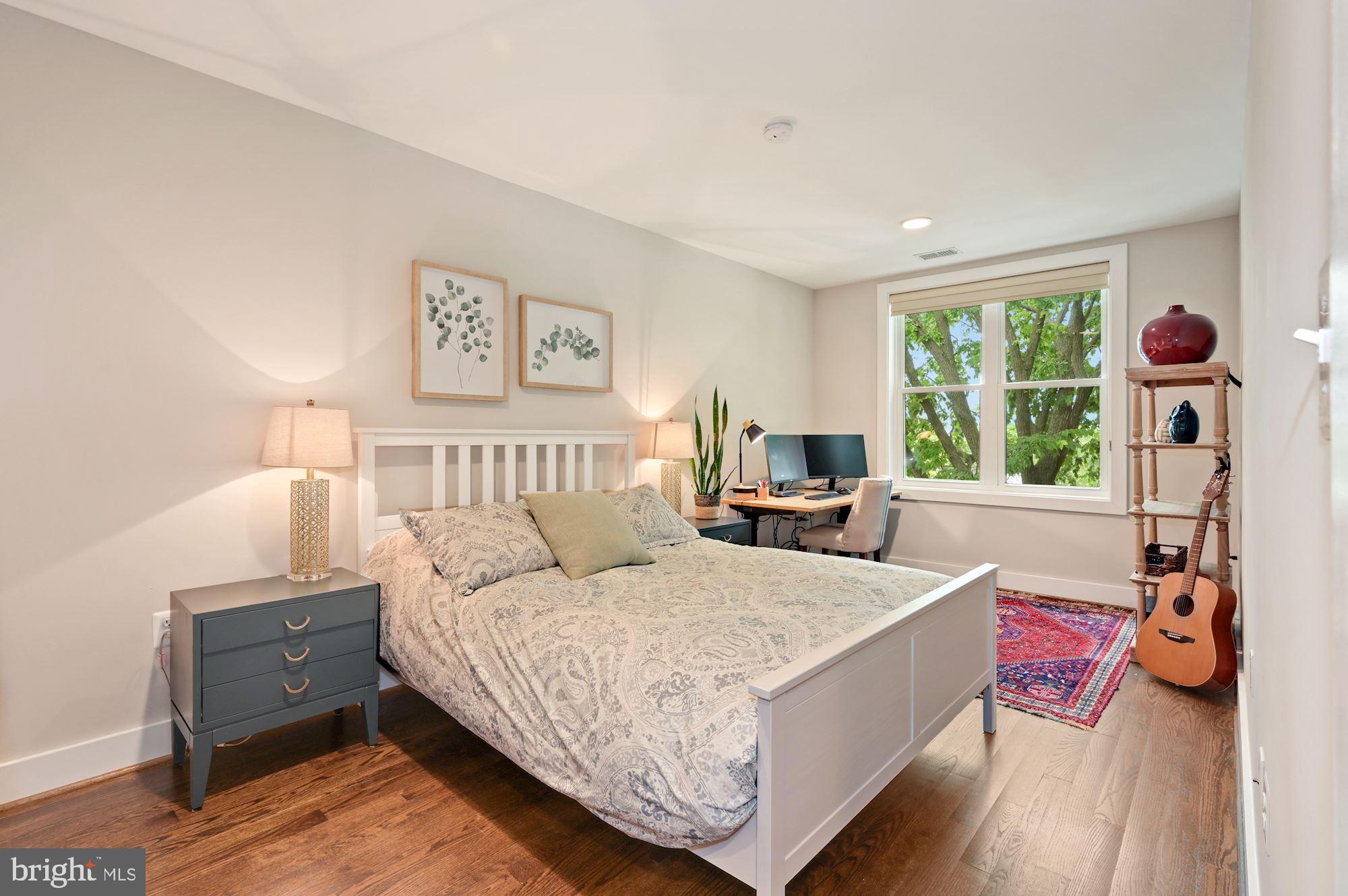 4110 3rd Street Northwest Washington, DC 20011 - Photo 21 of 35 a bed room with a bed and a window