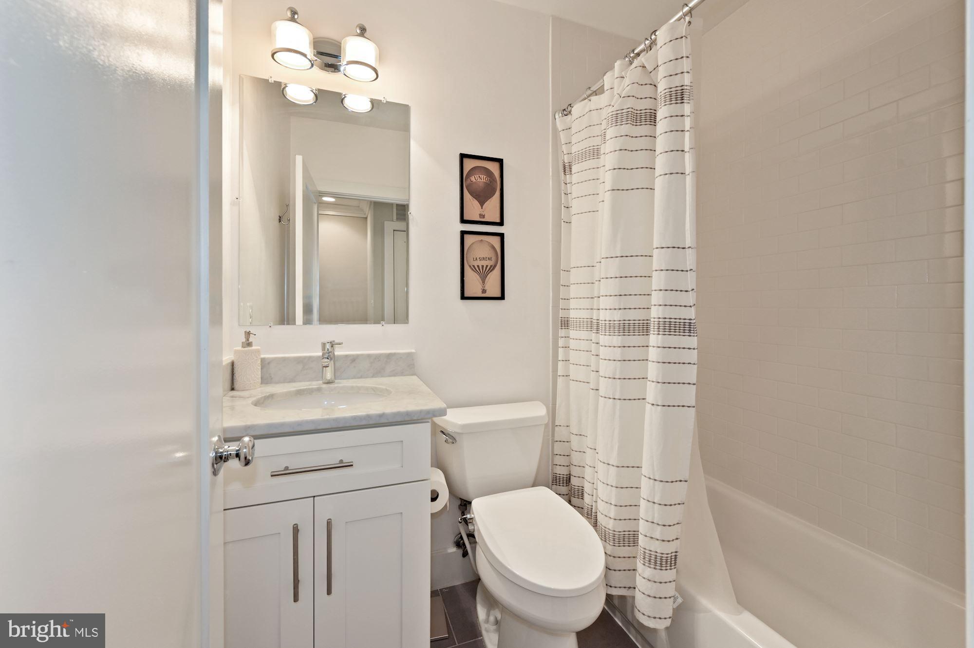 4110 3rd Street Northwest Washington, DC 20011 - Photo 25 of 35 a bathroom with a toilet a sink and mirror