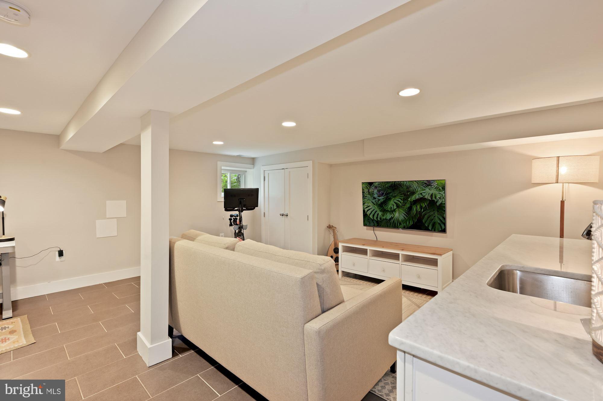 4110 3rd Street Northwest Washington, DC 20011 - Photo 26 of 35 a living room with furniture and a flat screen tv