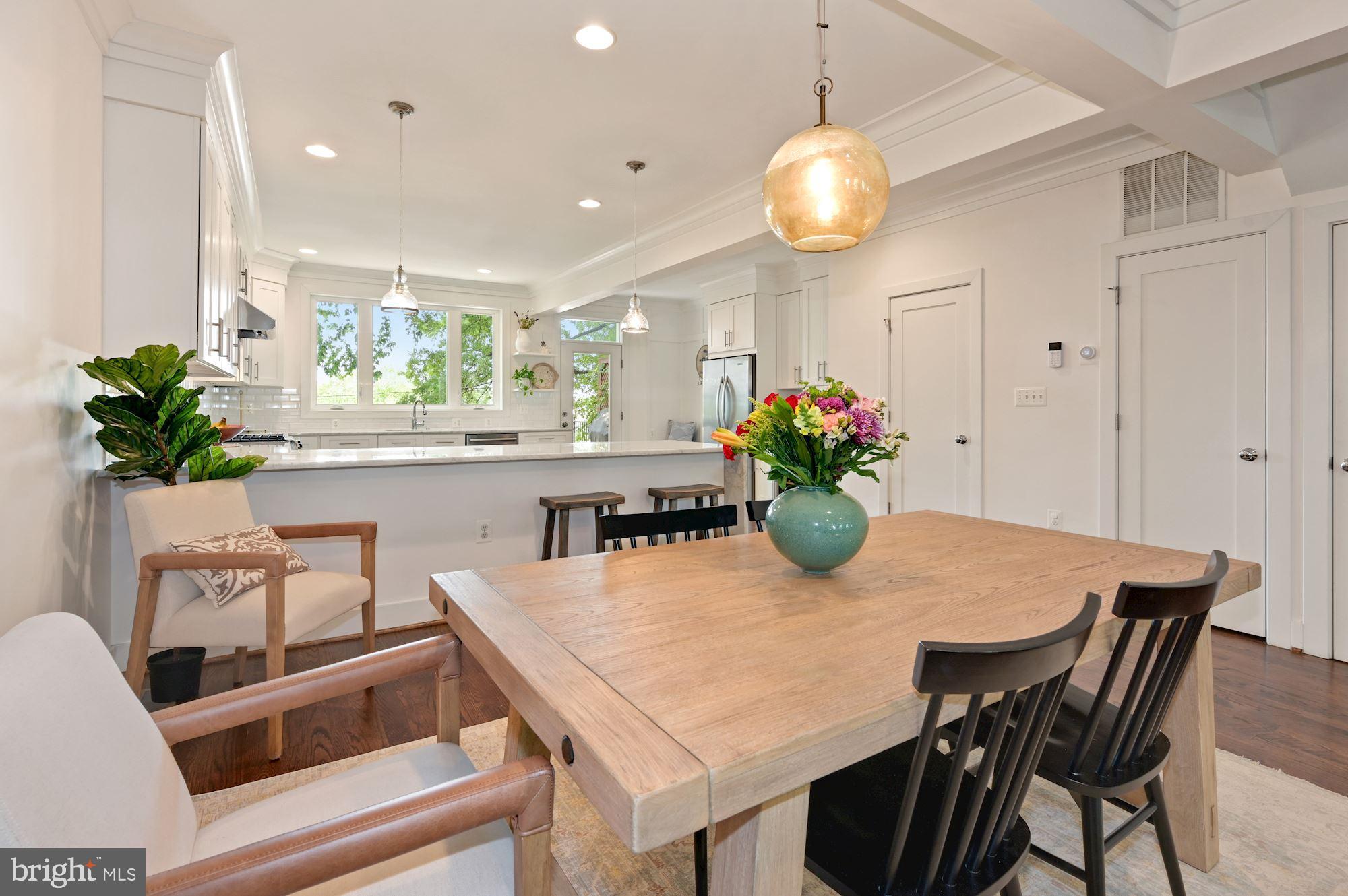 4110 3rd Street Northwest Washington, DC 20011 - Photo 10 of 35 a dining room filled chandelier and kitchen view