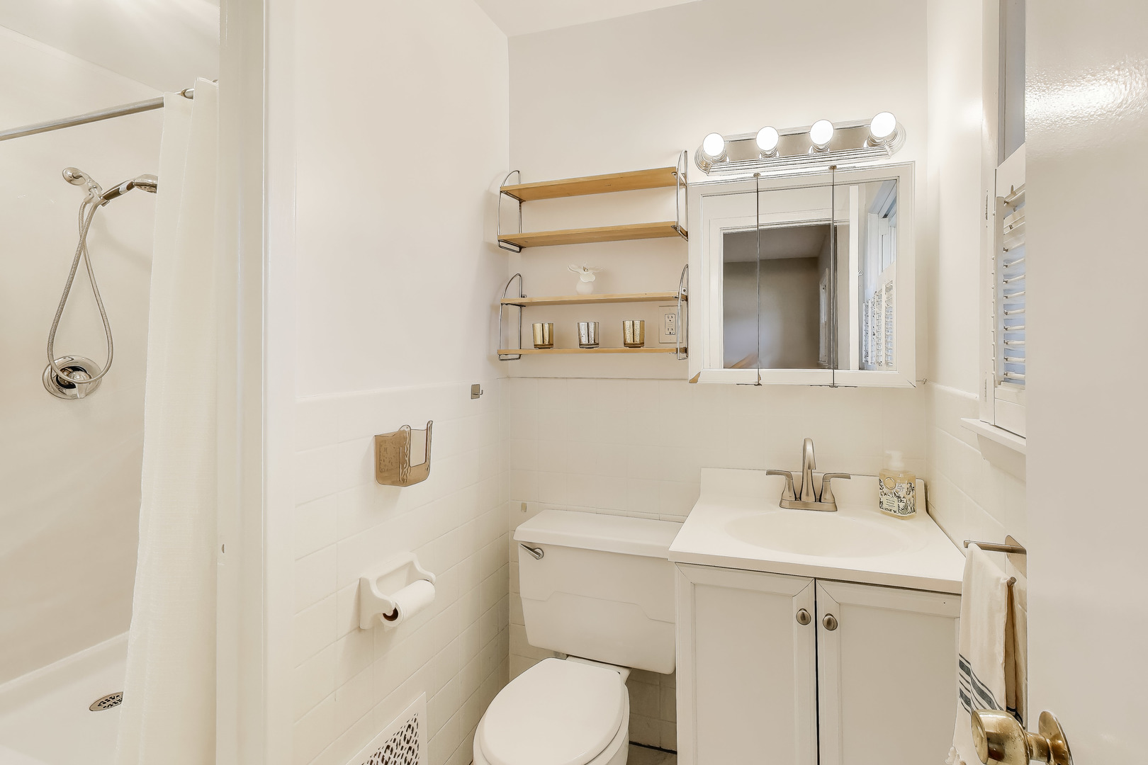 400 Landmeier Road Elk Grove Village, IL 60007 - Photo 19 of 33 a bathroom with a sink a toilet and mirror