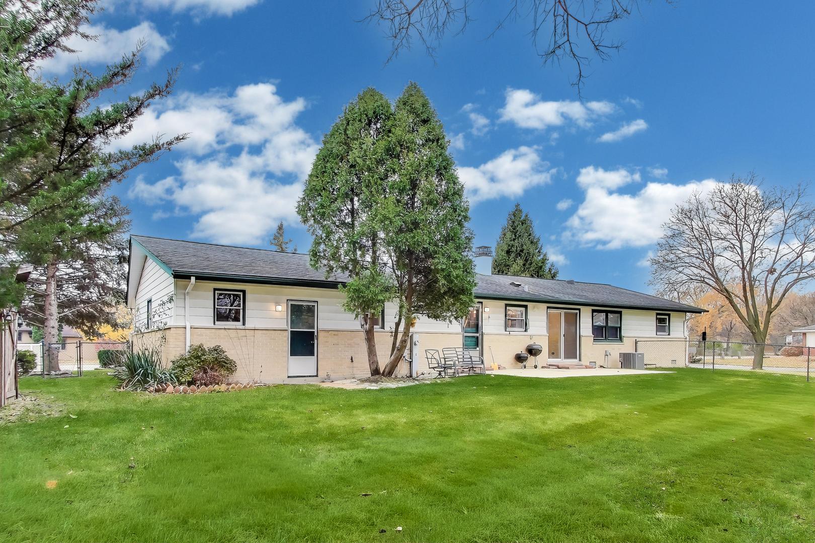 400 Landmeier Road Elk Grove Village, IL 60007 - Photo 30 of 33 a view of house that has a yard