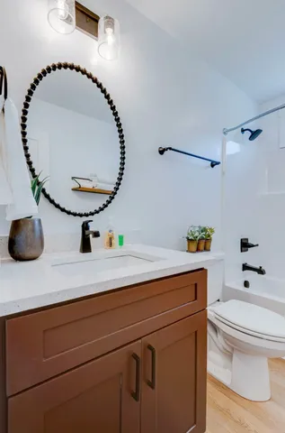 a bathroom with a toilet and a sink