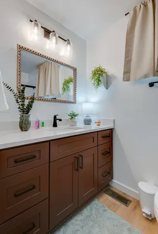 a bathroom with a sink and a mirror