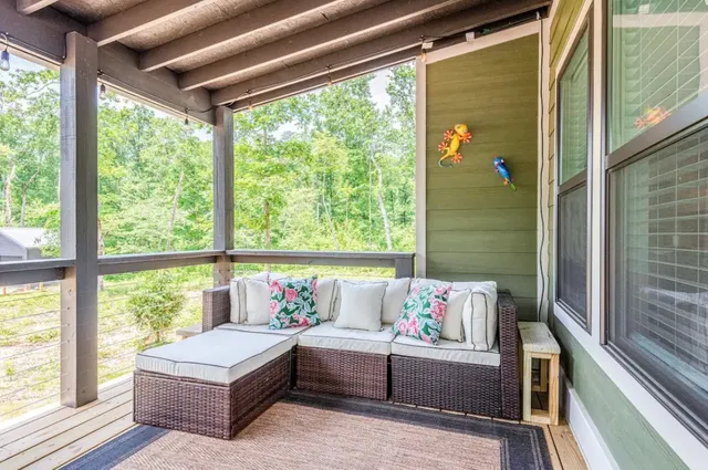 a bedroom with furniture and a window