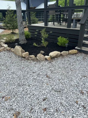 a wooden bench sitting in front of a building