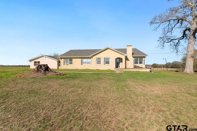 a bathroom with a sink and a yard