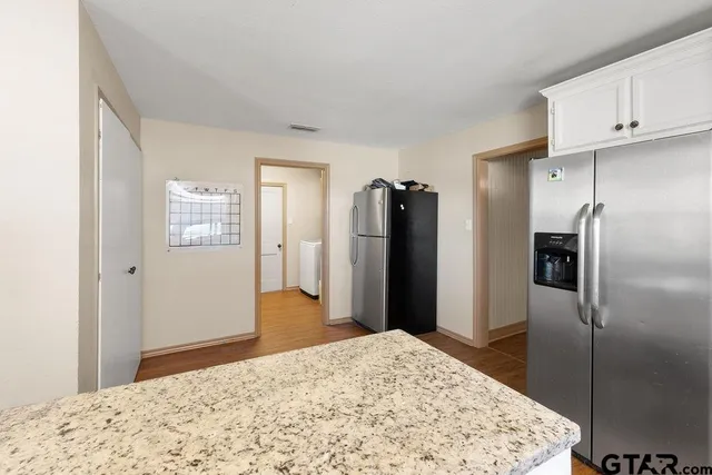 a bedroom with a bed and a dresser in it