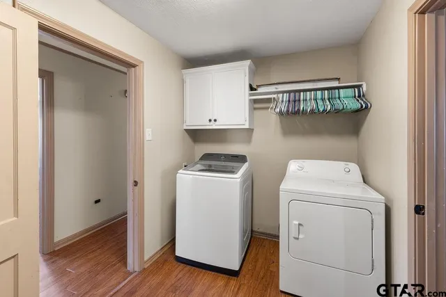a utility room with dryer and washer