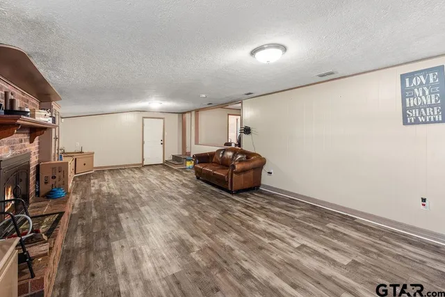 a room with a couch and a flat screen tv