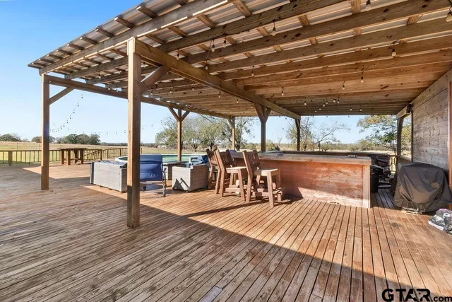 a view of a swimming pool with a patio