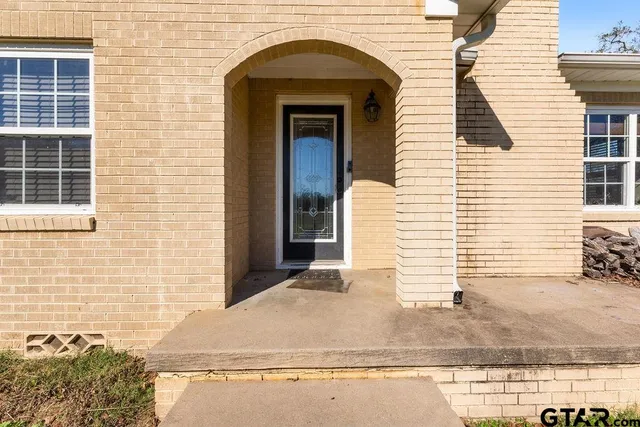 a view of a brick house with windows