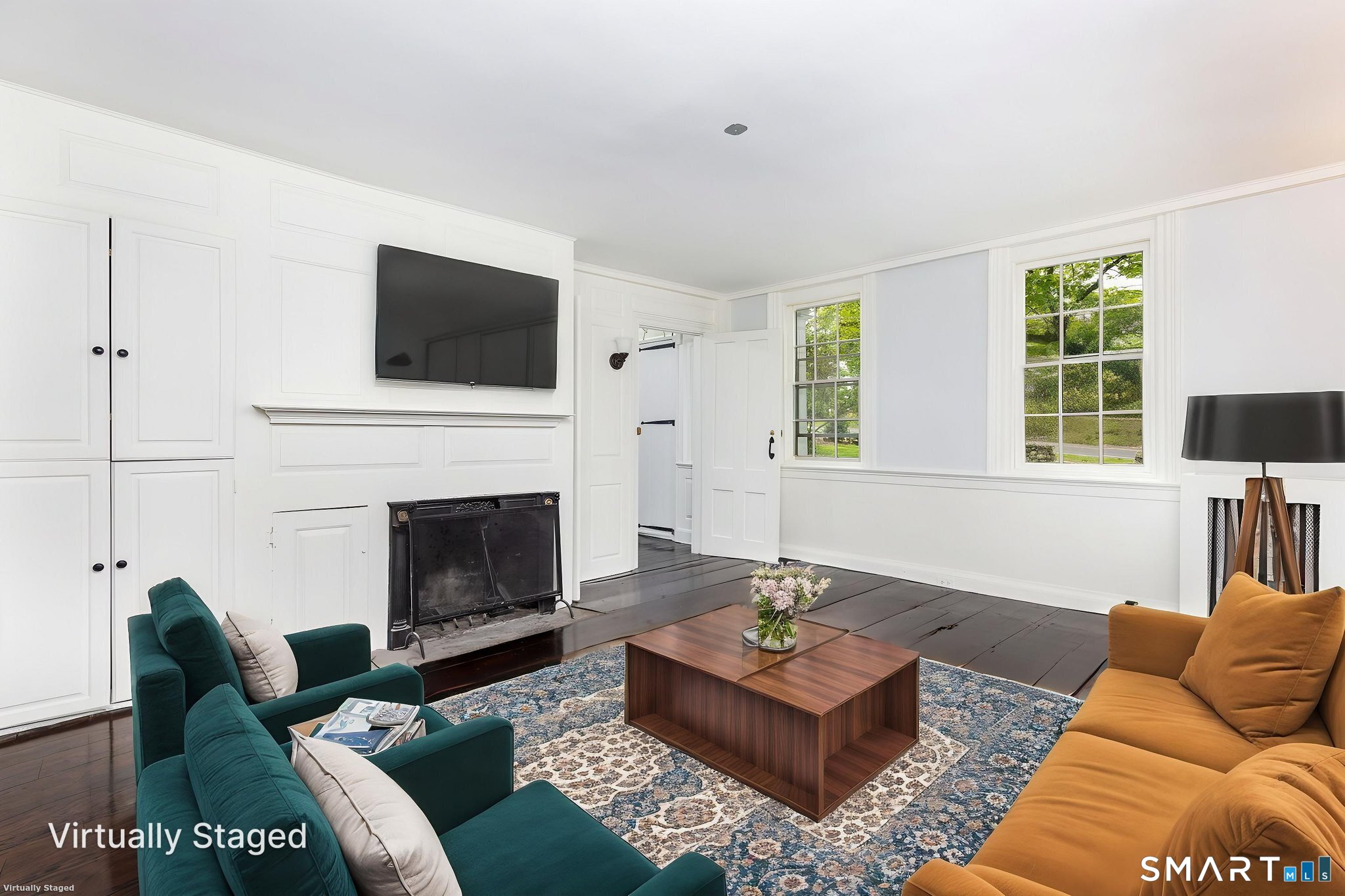 79 Deforest Street Watertown, CT 06795 - Photo 14 of 28 a living room with furniture a flat screen tv and a fireplace