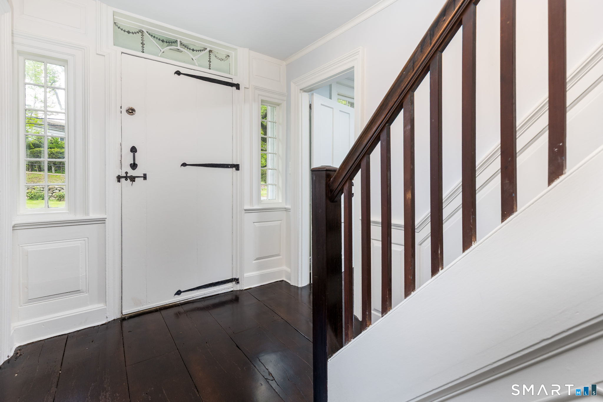 79 Deforest Street Watertown, CT 06795 - Photo 17 of 28 a view of a hallway with wooden floor and staircase