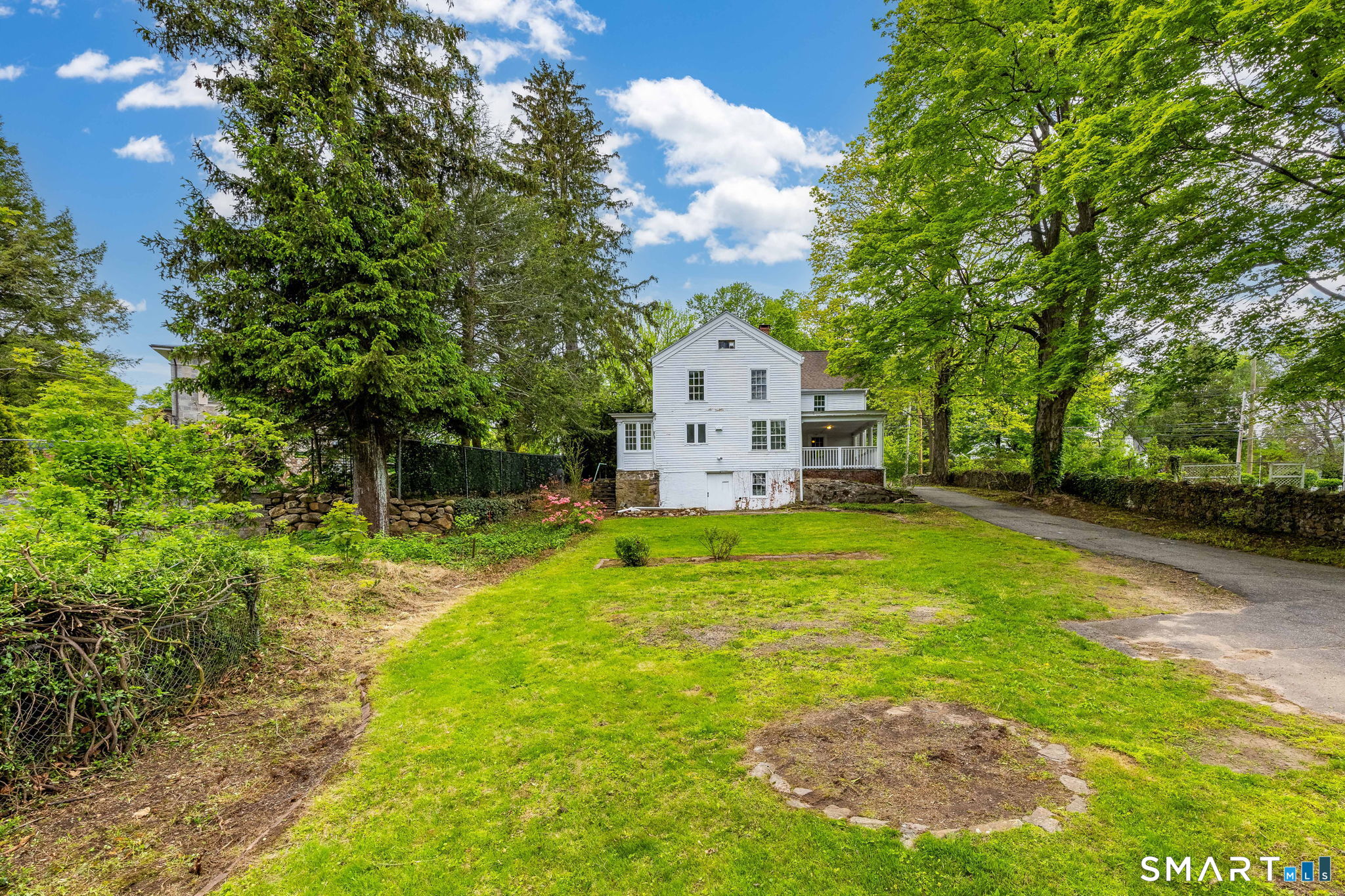 79 Deforest Street Watertown, CT 06795 - Photo 4 of 28 a view of a house with a yard