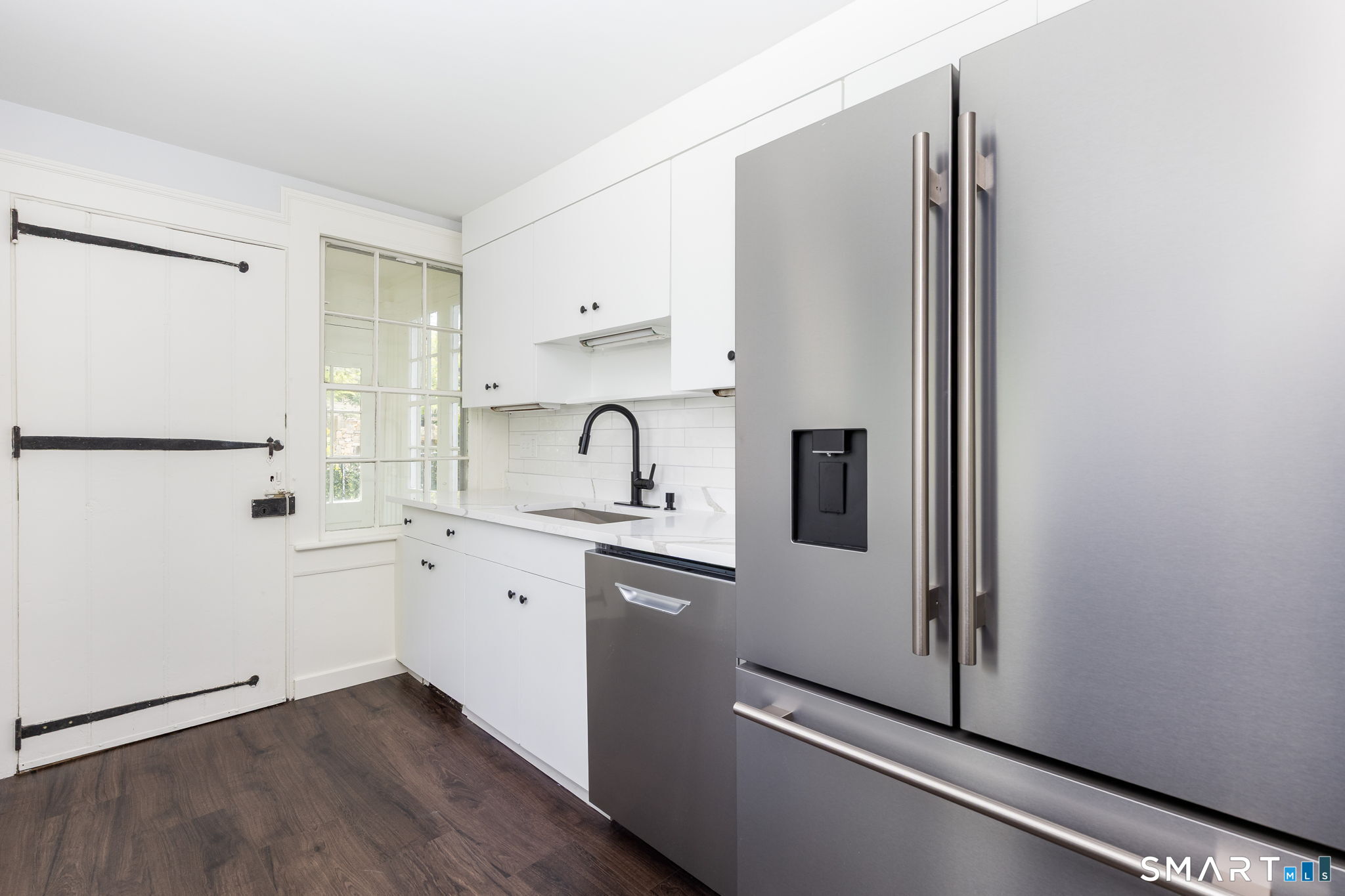 79 Deforest Street Watertown, CT 06795 - Photo 8 of 28 a kitchen with stainless steel appliances a refrigerator sink and cabinets