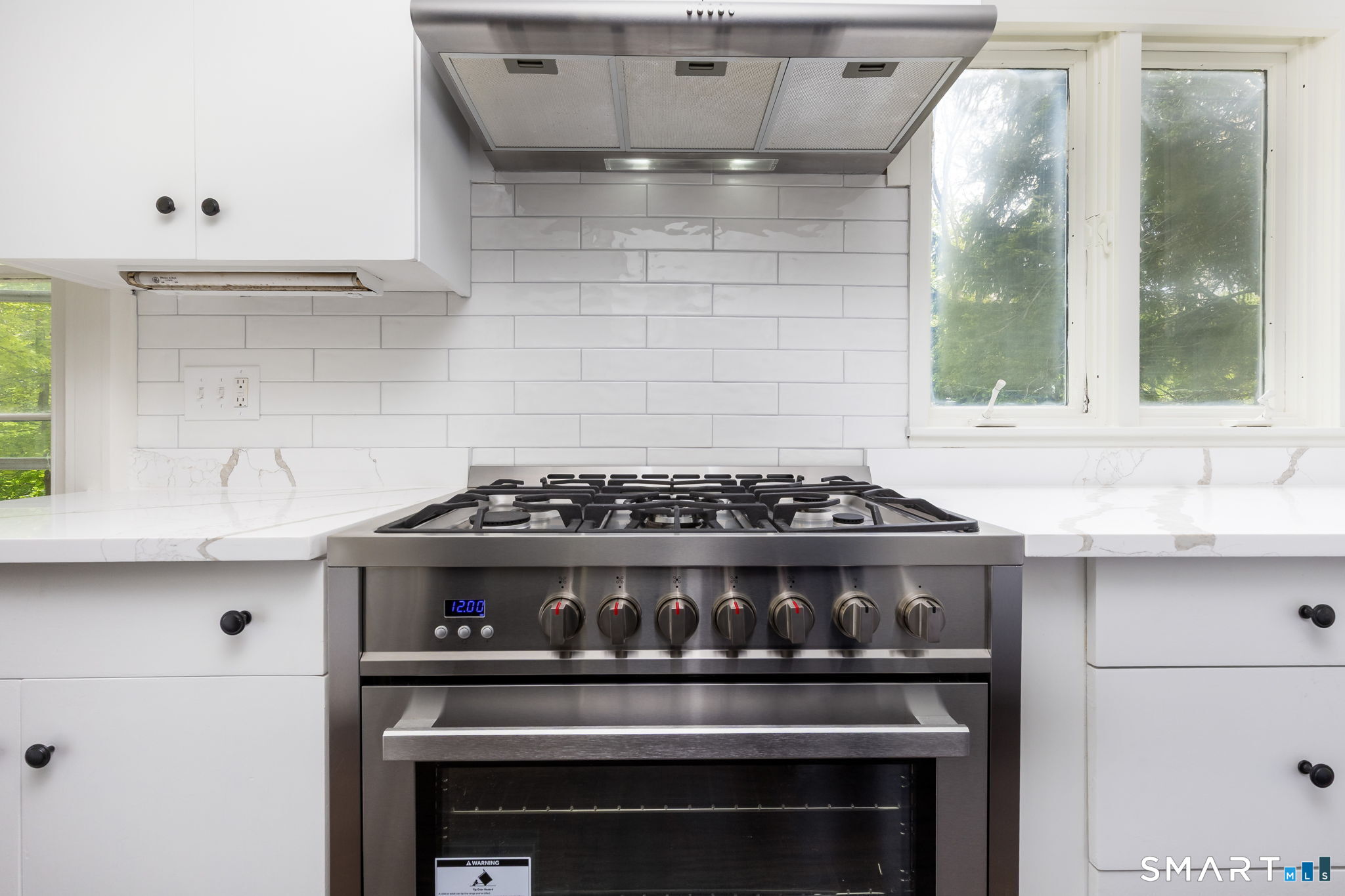 79 Deforest Street Watertown, CT 06795 - Photo 10 of 28 a kitchen with a stove and cabinets