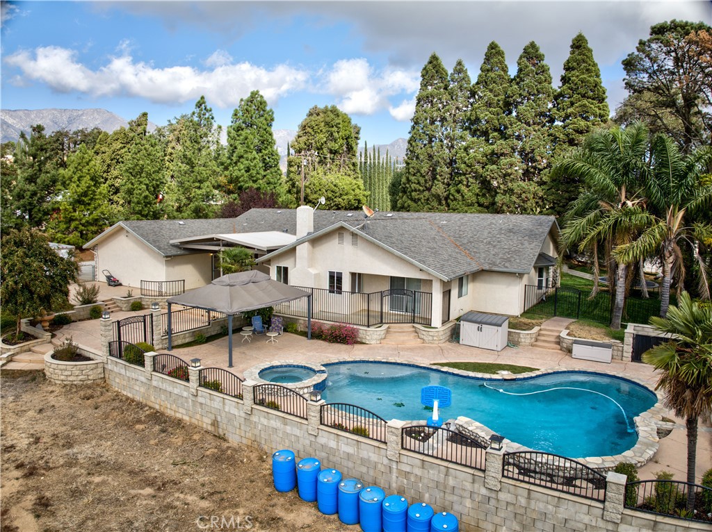 43350 Dunlap Street Banning, CA 92220 - Photo 6 of 21 aerial view of a house with swimming pool and chairs