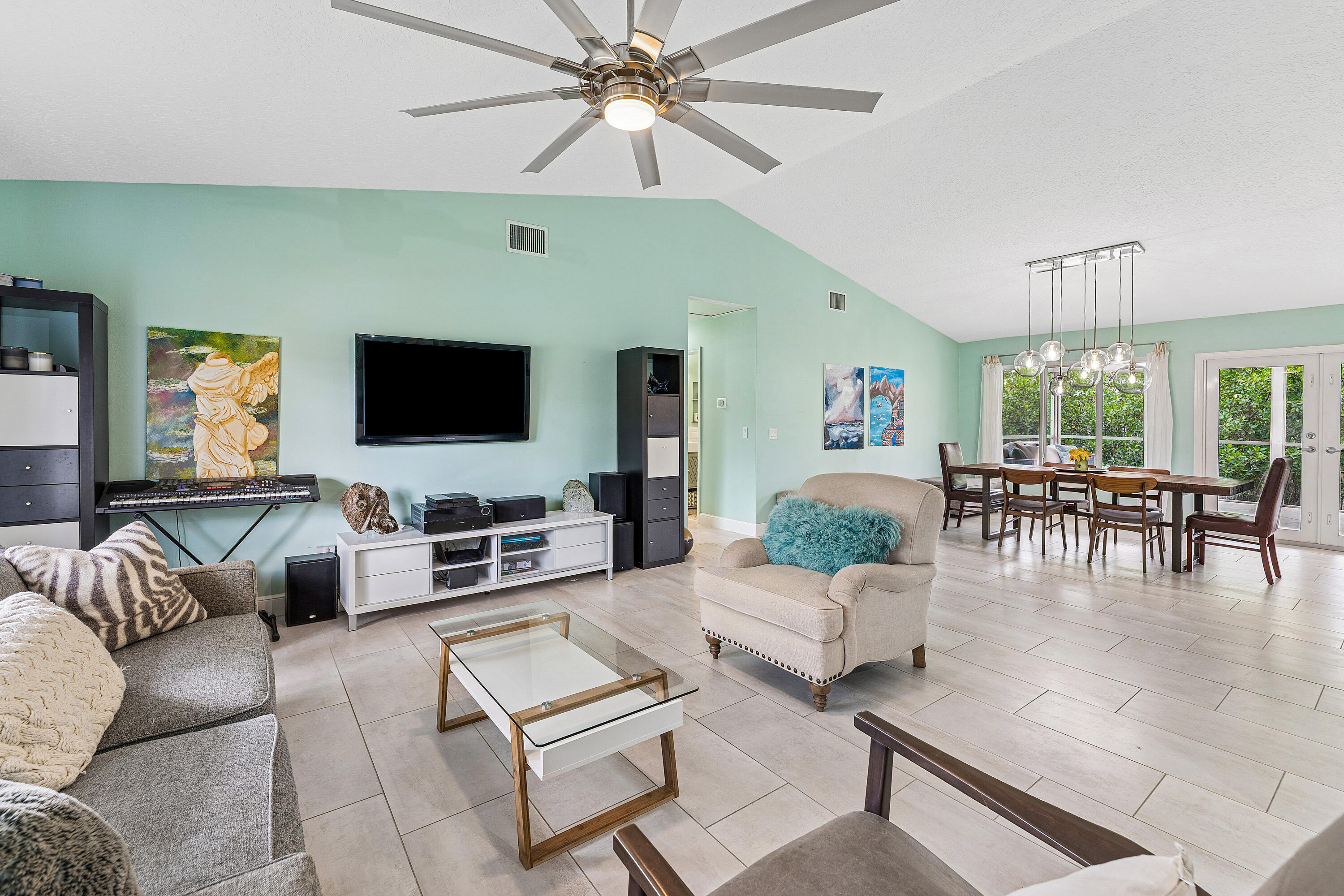 709 Warren Drive Jupiter, FL 33458 - Photo 16 of 56 a living room with furniture and a flat screen tv