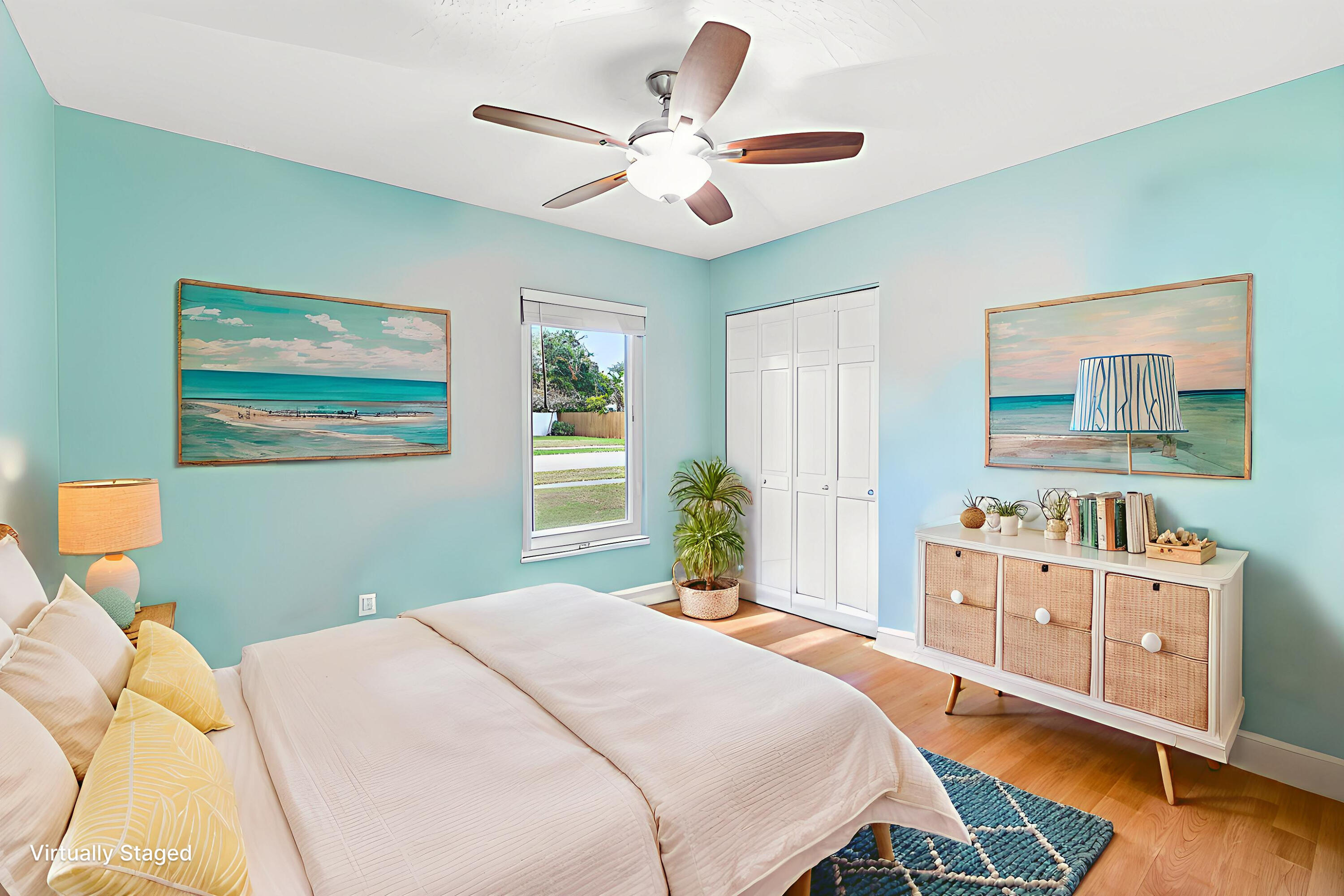 709 Warren Drive Jupiter, FL 33458 - Photo 17 of 56 a bedroom with a bed and a chandelier
