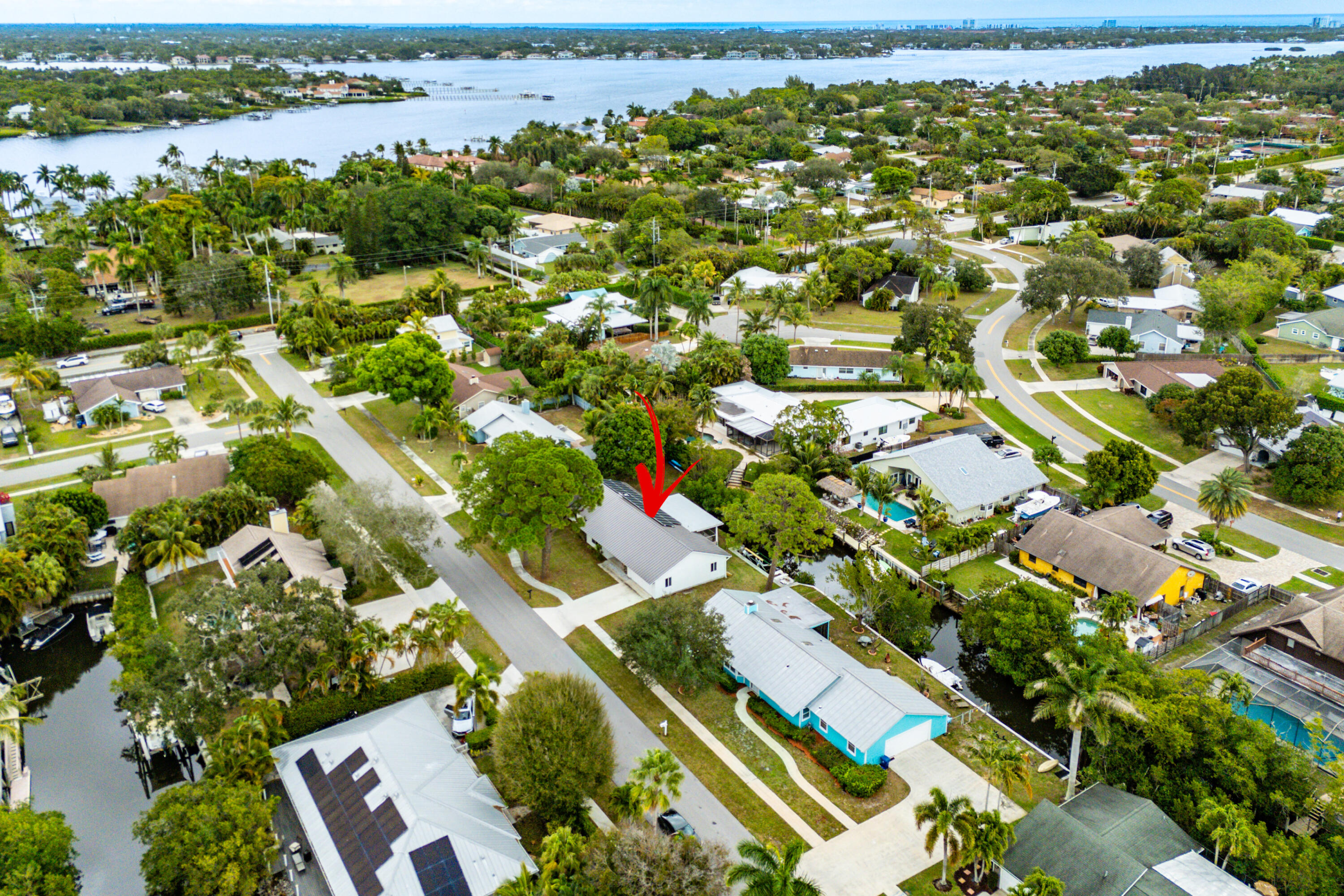 709 Warren Drive Jupiter, FL 33458 - Photo 2 of 56 an aerial view of residential houses with outdoor space and trees