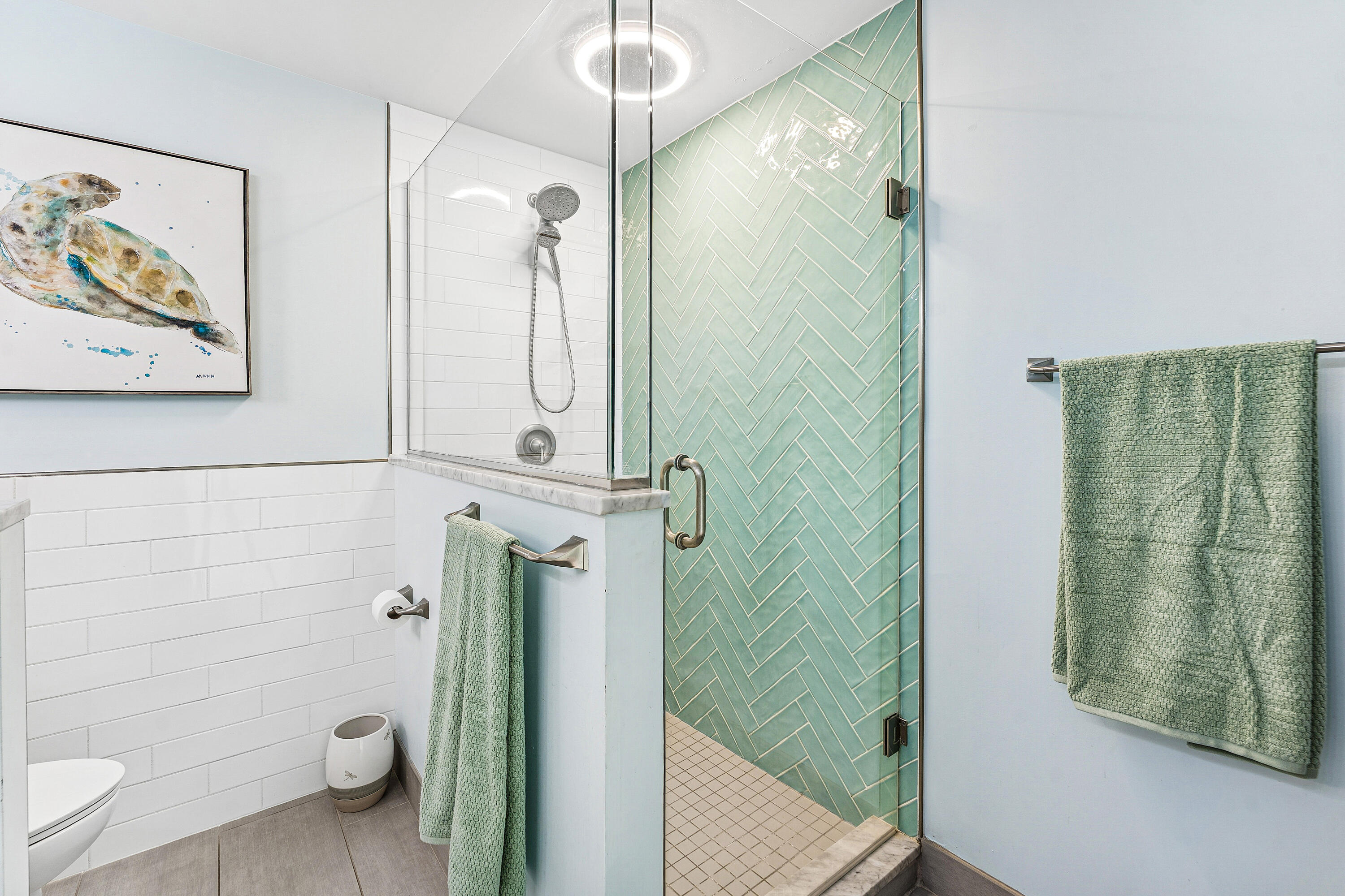 709 Warren Drive Jupiter, FL 33458 - Photo 27 of 56 a bathroom with a shower and toilet