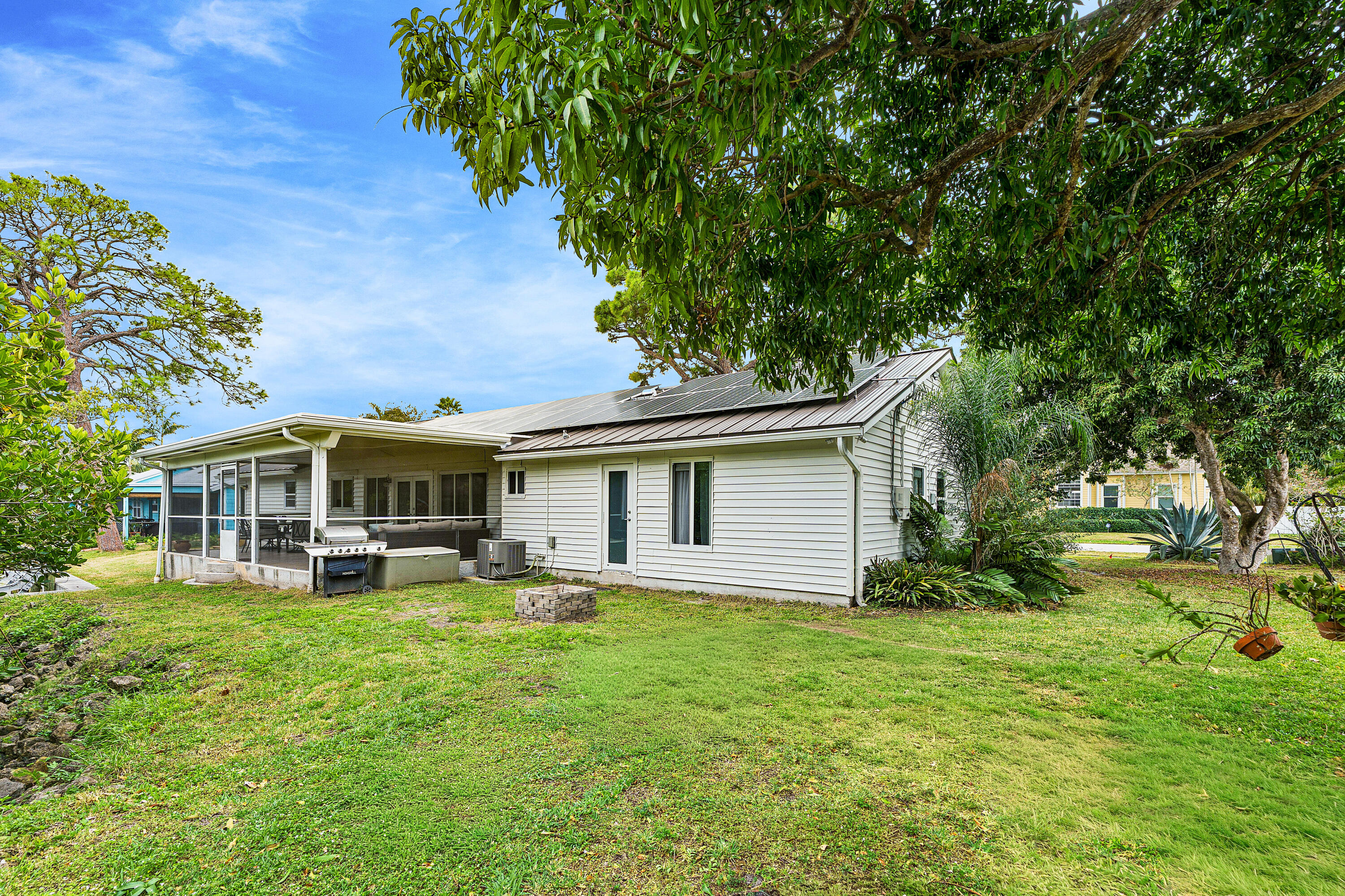 709 Warren Drive Jupiter, FL 33458 - Photo 37 of 56 a view of a house with a yard porch and sitting area