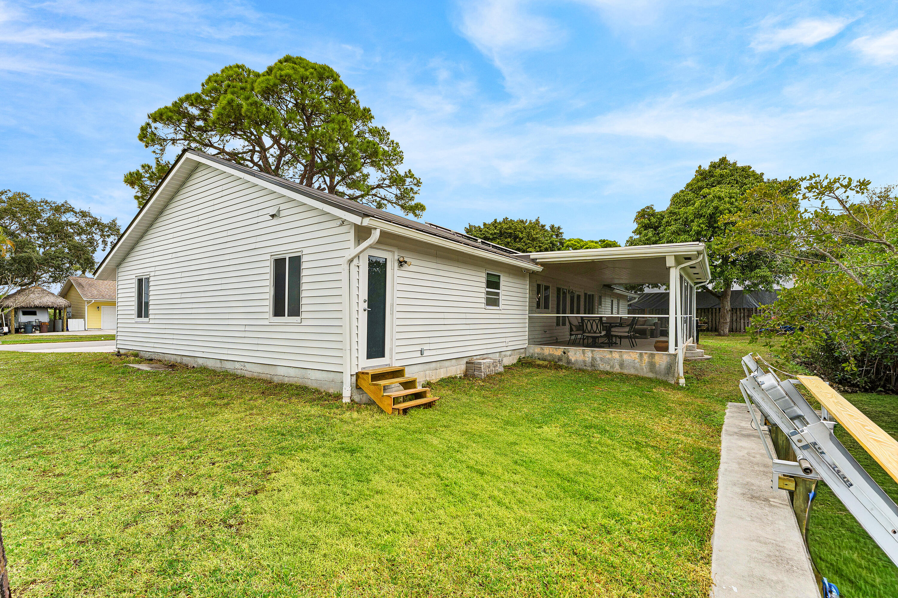 709 Warren Drive Jupiter, FL 33458 - Photo 42 of 56 a view of a house with backyard
